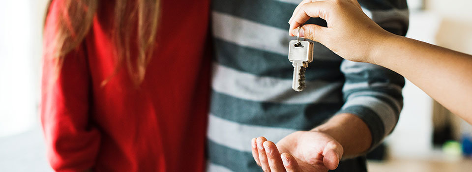 Giving keys to new homeowners