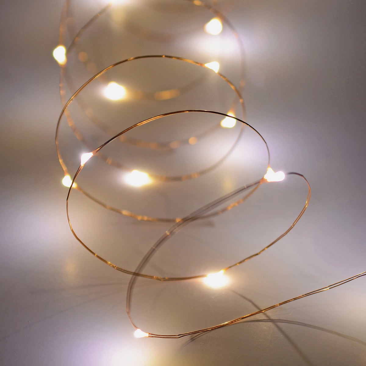 Alpine 10-1/2 Ft. 60-Light Warm White LED Battery Operated Copper String Light Set Image 4